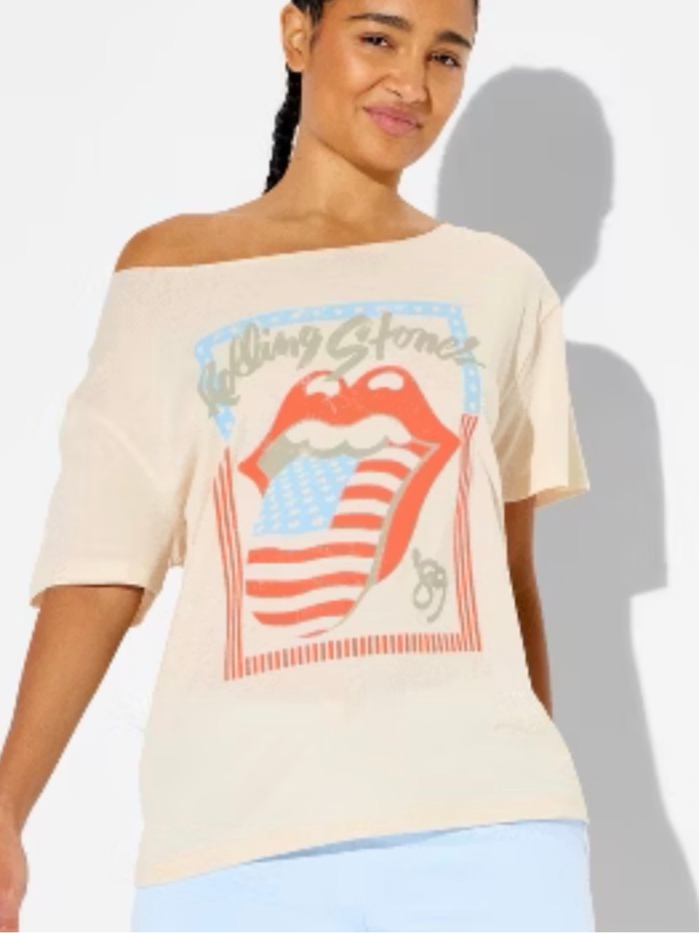 the Rolling Stones Cream Off-Shoulder Graphic Tee with Flag Tongue tour 89